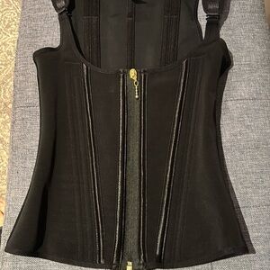 Double layered bustier or chest binding garment